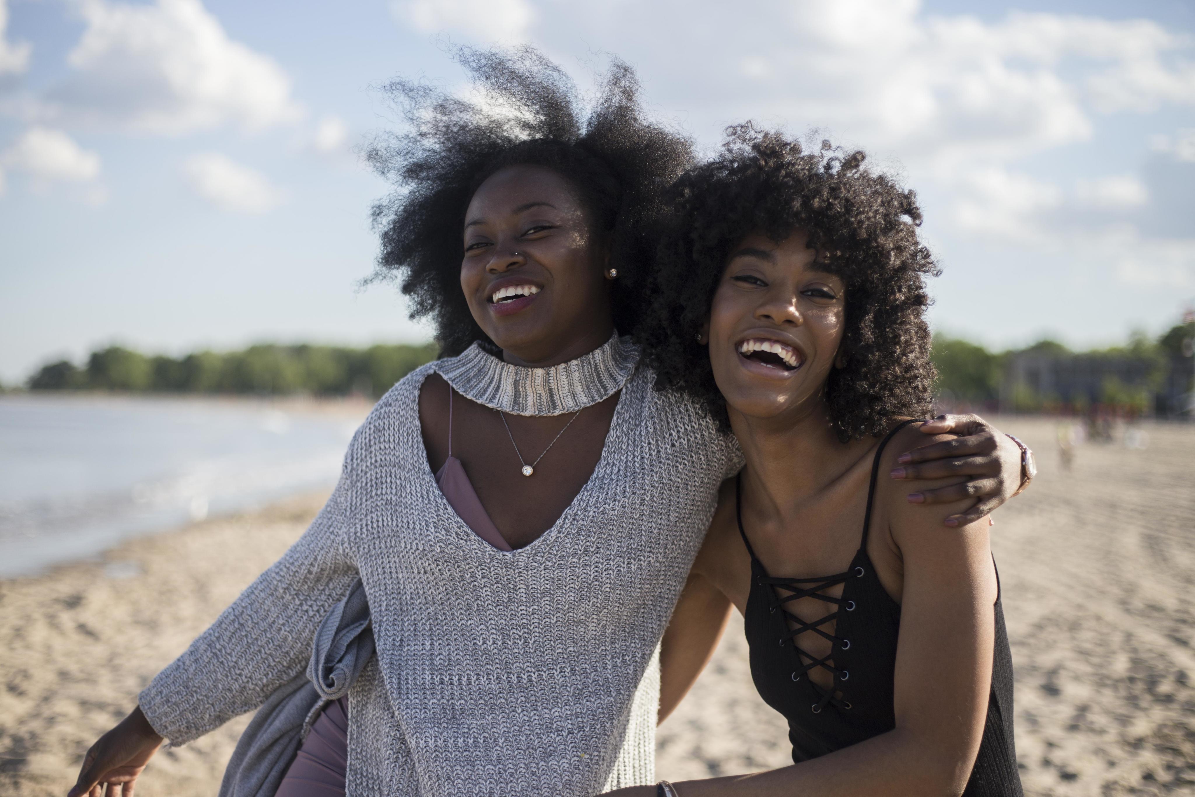 Friends laughing on beach