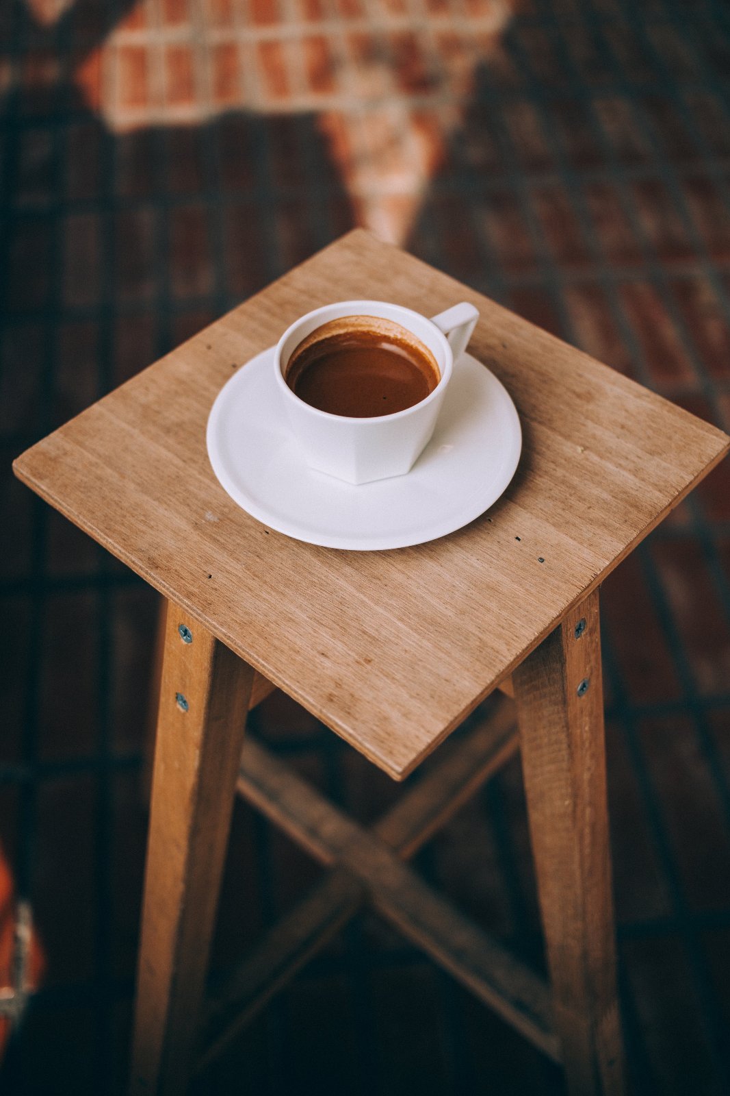 long-espresso-sits-on-a-wooden-stool.jpg